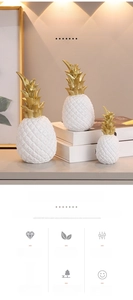 Detailed trio of modern resin pineapple ornaments with white texture and matte gold leaves