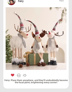 Three Nordic felt Christmas reindeer dolls with knit hats on a white festive tabletop