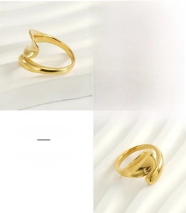 Detail view of gold wave adjustable ring made of polished 18k stainless steel material