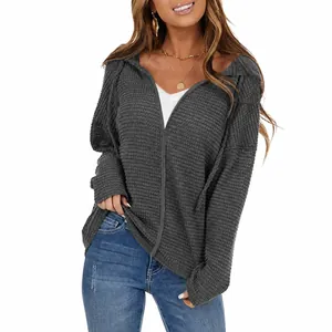 Detailed texture of women's waffle knit drawstring hoodie jacket in army green color