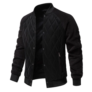 Detail of men's black diamond-quilted jacket featuring snap buttons and raglan sleeves
