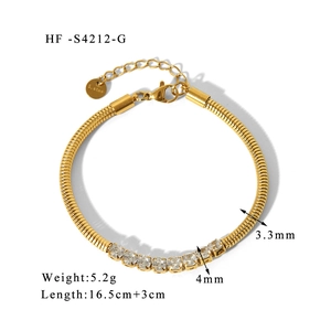 Macro detail of 18K gold plated stainless steel spring chain bracelet with zircon stones