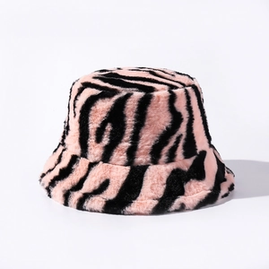 Detailed close-up of fluffy pink and black zebra print faux fur bucket hat material