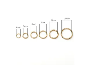 Detail of gold stainless steel open jump rings in sizes 4mm to 10mm for DIY jewelry making
