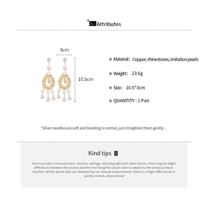 Detailed product size chart for gold drop pearl earrings with rhinestone accents