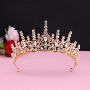 Detail of baroque gold bridal crown with white rhinestones and pear-cut crystals