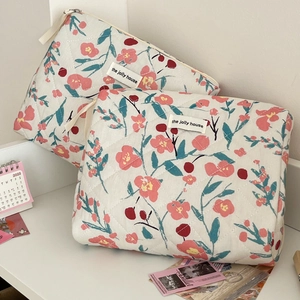 Quilted floral cosmetic bag set with cherry patterns and top handle for travel