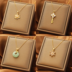 Titanium steel necklace set featuring maple leaf, key, jade piece and snowflake pendants