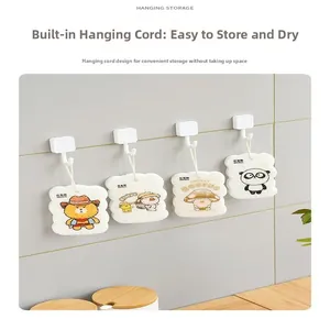 Hanging wood pulp sponges with cartoon prints and lanyards for easy kitchen storage