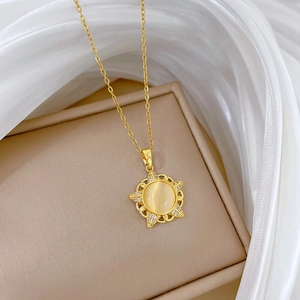 Close-up of starburst cat-eye pendant with sparkling crystals in a beige jewelry box