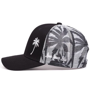Close-up of tropical palm tree embroidery and Your Life text on black mesh trucker cap