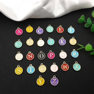 Detailed view of colorful 26 A-Z alloy alphabet charms for DIY jewelry making