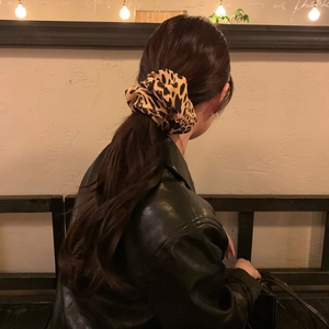 Leopard print oversized scrunchie for women shown in a high ponytail hairstyle