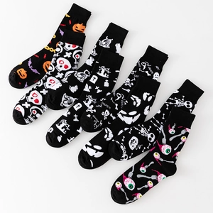 Set of 6 Halloween crew socks with colorful pumpkin and ghost prints on black knit fabric