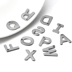Detailed view of silver stainless steel A-Z letter charms for DIY jewelry making