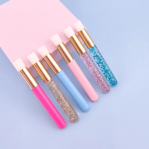 Set of six colorful eyelash and nose cleaning brushes with glitter and solid handles