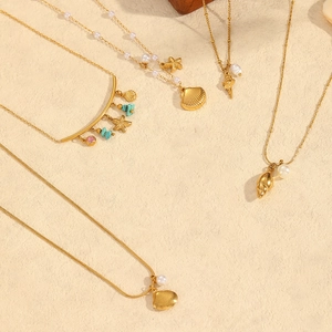 Gold stainless steel shell and starfish charm necklaces with pearls and teal stone beads