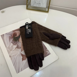 Detailed view of dark brown faux mink velvet gloves with touch screen fingertips