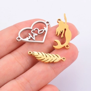 Pendentifs en acier inoxydable cœur sirène et plume en finitions or et argent