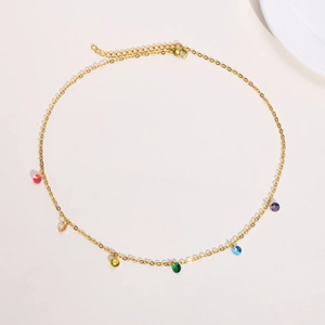 Detail of 18K gold plated necklace featuring colorful rainbow gemstones and lobster clasp