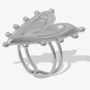 Macro detail of silver heart ring featuring beaded edges and adjustable double-band design