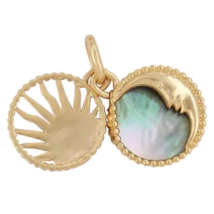 Macro view of gold copper celestial sun and moon pendant with shell inlay for jewelry DIY