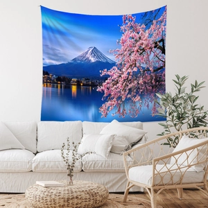 Detail of Mt Fuji tapestry with cherry blossoms hanging on a modern living room wall