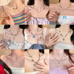 Detailed grid showing diverse beaded and pearl bow necklaces worn by a fashion model