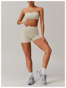 Detail of cream yoga set with ribbed sports bra and high-waisted seamless shorts