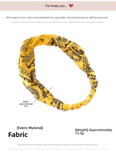Close-up showing the 5cm width and 13.5g weight of this yellow paisley twisted headband
