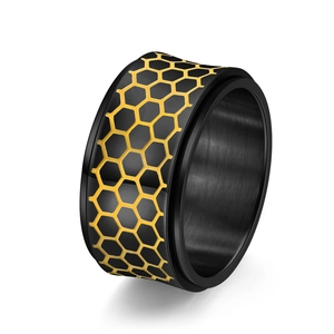 Luminous spinning honeycomb ring for men in black and gold stainless steel finish