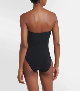 Rear view of black strapless one-piece swimsuit featuring a minimalist open back design
