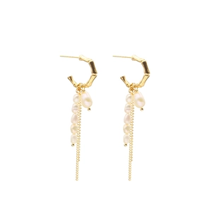 Elegant gold bamboo hoop earrings with natural pearl tassels and sleek metal chains
