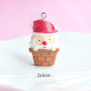 Detail view of resin Santa in chimney pendant with gold glitter finish, 2x3cm size