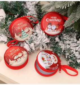 Detailed view of colorful Christmas coin purses featuring Santa and reindeer on pine branches
