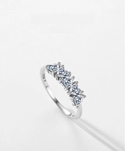 Detail view of S925 sterling silver ring showing five heart-shaped cubic zirconia stones