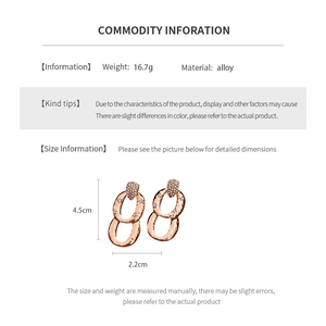 Detail showing dimensions and 16.7g weight of textured gold oval drop earrings