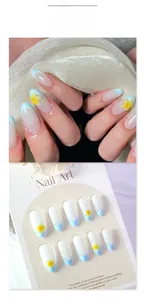 Close-up of blue French press-on nails featuring 3D tropical yellow flower designs
