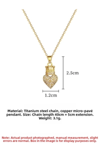Macro shot of titanium steel crown heart necklace with intricate pave set crystals