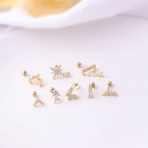 Set of 8 gold stainless steel stud earrings featuring star, moon, and butterfly shapes