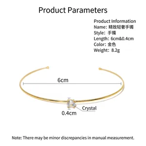 Modern gold plated titanium steel bangle featuring a sparkling moissanite crystal inlay