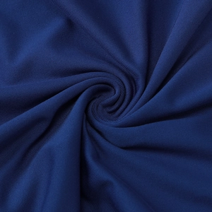 Detailed macro shot of dark blue knitted fabric with fine horizontal weave and silky sheen