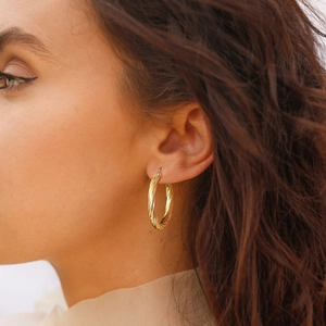 Minimalist gold twisted C-shaped hoop earrings in high-quality stainless steel for women