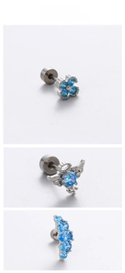 Detailed view of three blue zircon titanium steel screw back earrings in a set