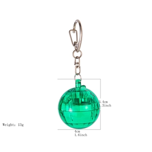 Detailed view of green translucent sphere keychain with 13g weight and dimension markers