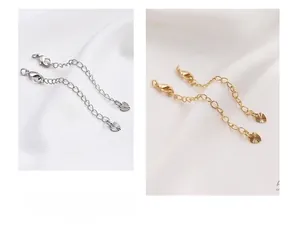 Detailed view of 14K gold and silver extender chains with heart pendants for DIY jewelry