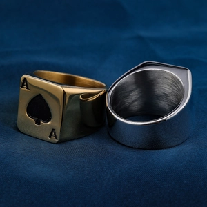 Macro shot of stainless steel Ace of Spades ring with gold polish and silver brushed finish