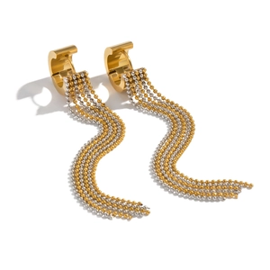 Detail of two-tone gold and silver beaded tassel earrings with polished hoop closure