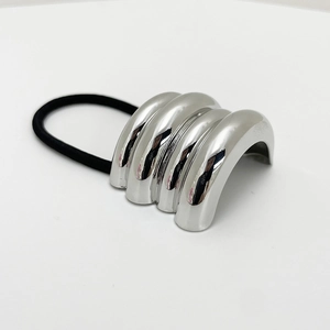 Detail of silver metallic shell hair tie with high-elasticity black rubber band