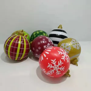 Close-up of 60cm PVC inflatable Christmas balls with various patterns and gold hangers